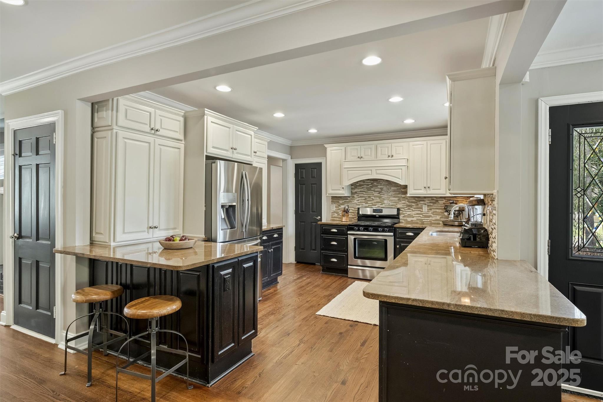830 Jefferson Drive Charlotte, NC 28270 - Photo 10 of 38 a kitchen with stainless steel appliances granite countertop a stove a sink and a refrigerator