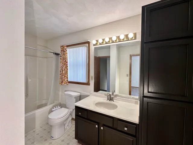 a bathroom with a sink double vanity and a mirror