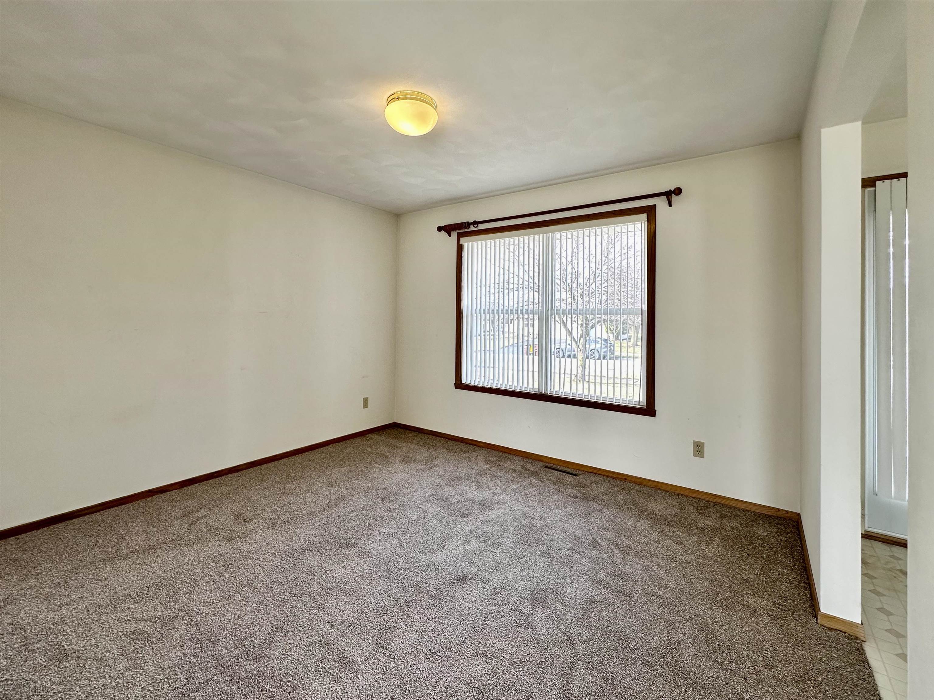 6497 Maeve Lane Rockford, IL 61107 - Photo 2 of 24 an empty room with windows