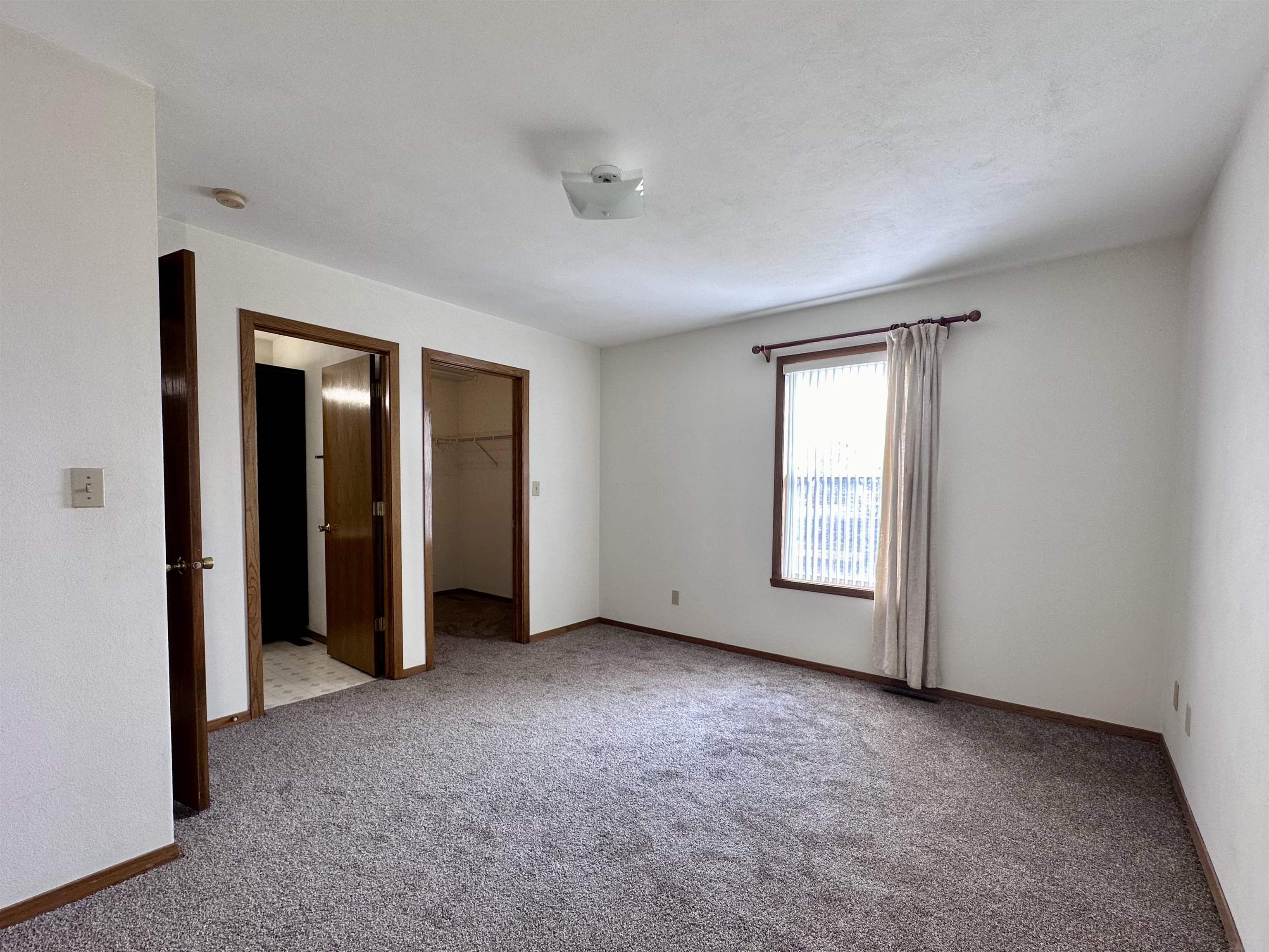 6497 Maeve Lane Rockford, IL 61107 - Photo 7 of 24 an empty room with windows and closet