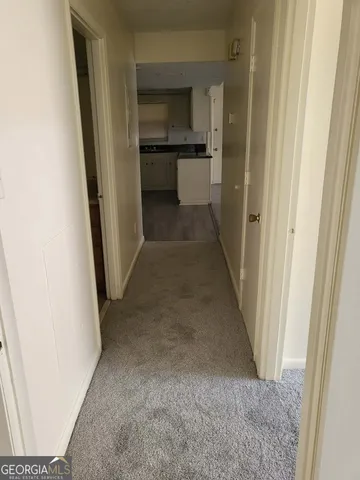 a view of a hallway view with staircase