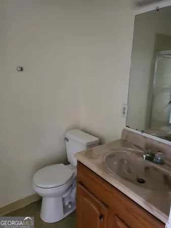a bathroom with a sink and a toilet