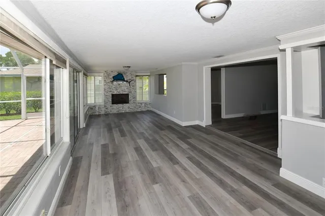 a view of a room with wooden floor staircase and windows