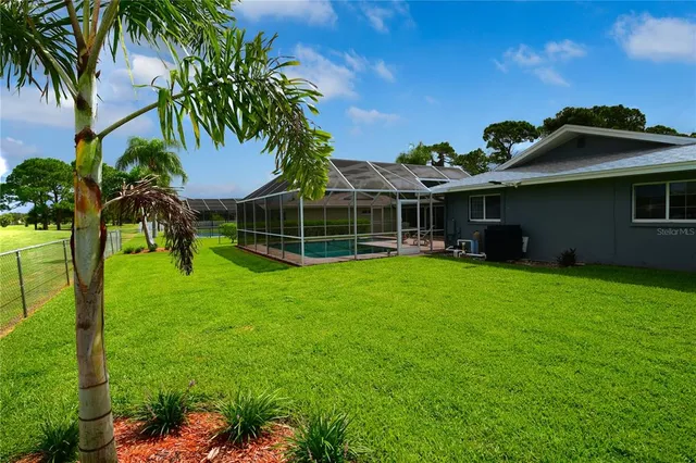 a view of a park with chairs and a slide