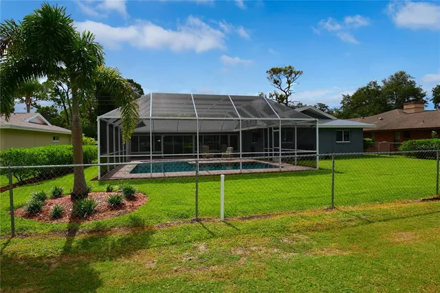 a view of a chair and table in the patio