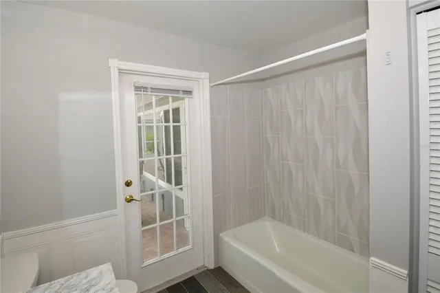 a bathroom with a bathtub and a shower