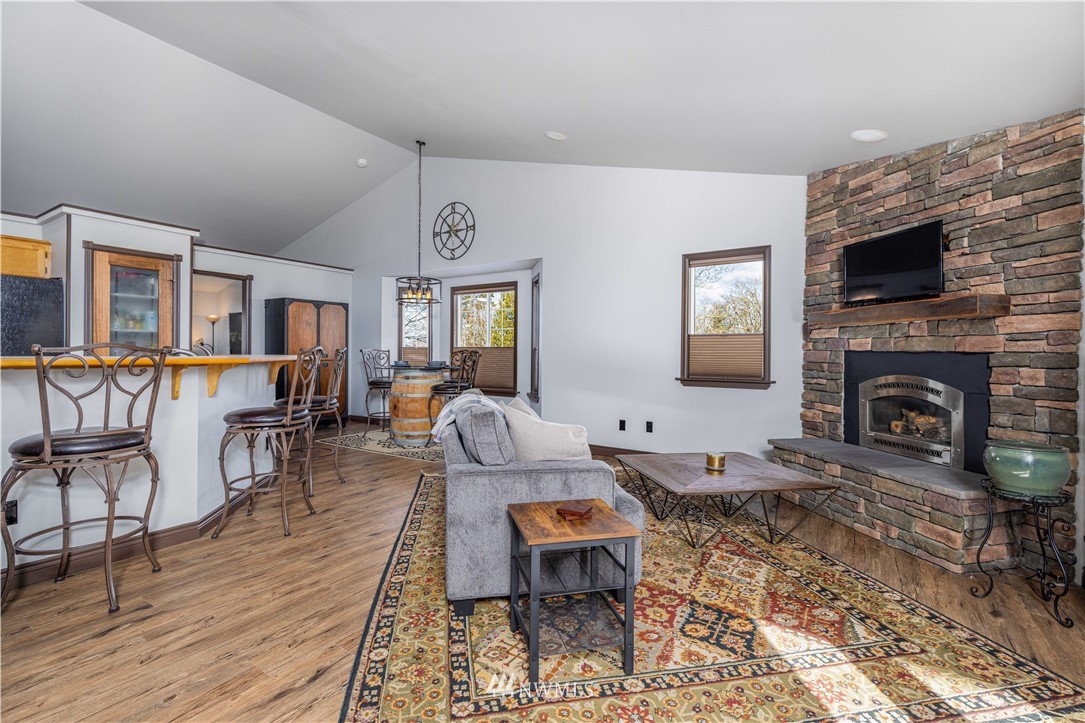 25904 202nd Avenue Southeast Covington, WA 98042 - Photo 11 of 24 a living room with furniture and a fireplace
