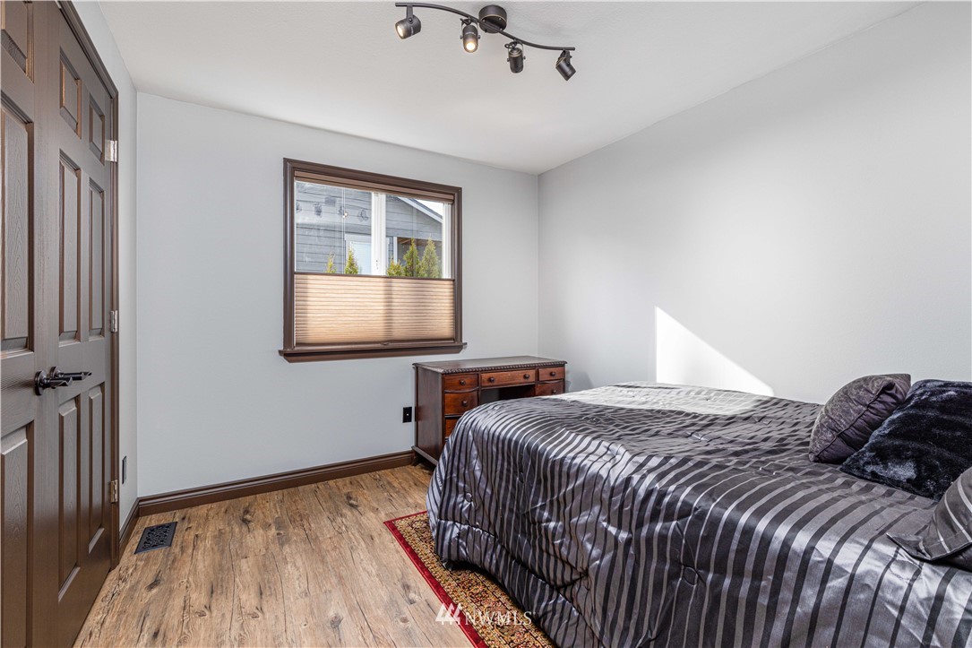 25904 202nd Avenue Southeast Covington, WA 98042 - Photo 13 of 24 a bedroom with a bed and a window