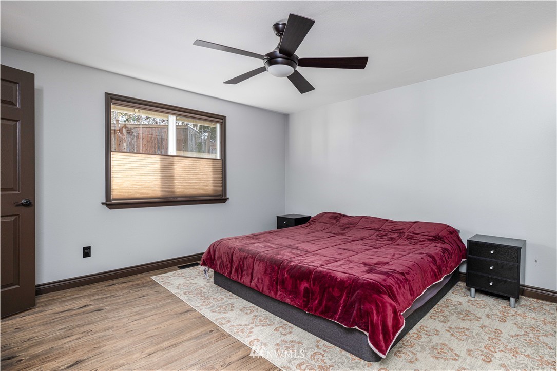 25904 202nd Avenue Southeast Covington, WA 98042 - Photo 17 of 24 a bedroom with a bed and a window
