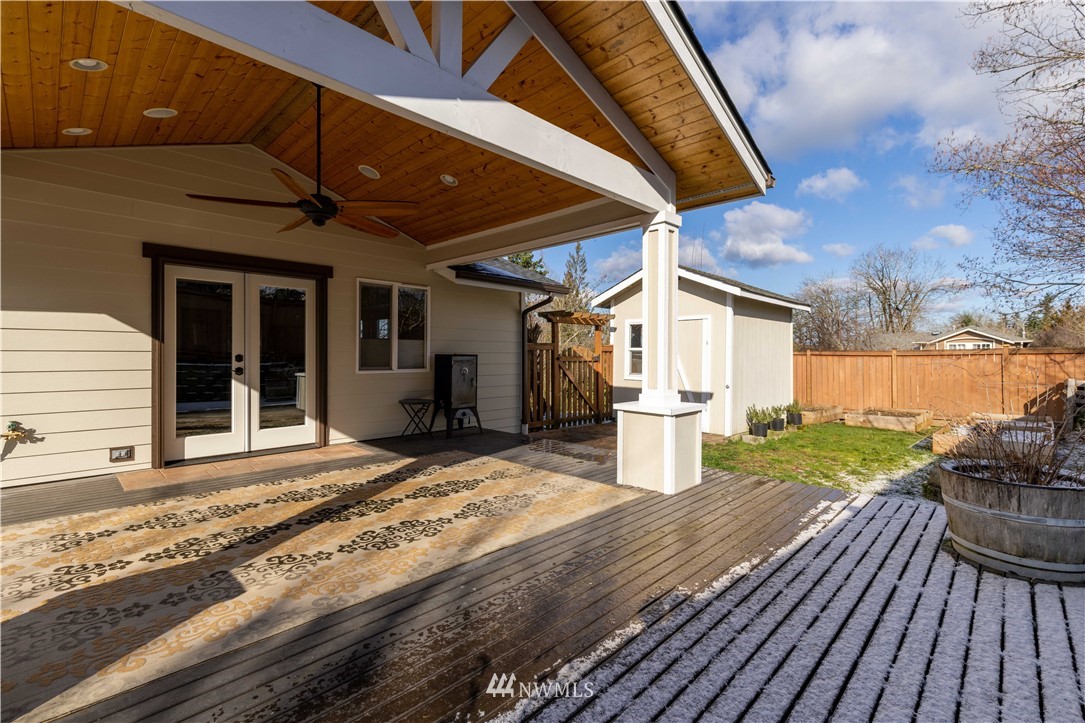 25904 202nd Avenue Southeast Covington, WA 98042 - Photo 19 of 24 a view of a house with wooden floor and iron fence