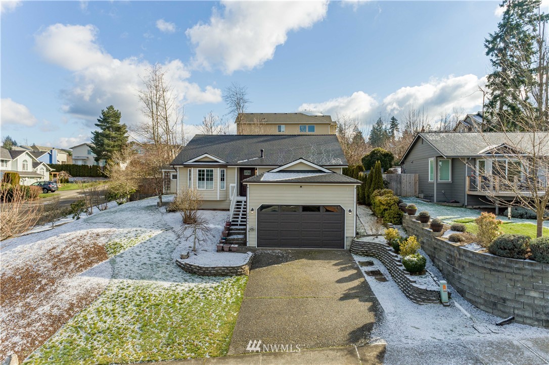 25904 202nd Avenue Southeast Covington, WA 98042 - Photo 2 of 24 a front view of a house with garden
