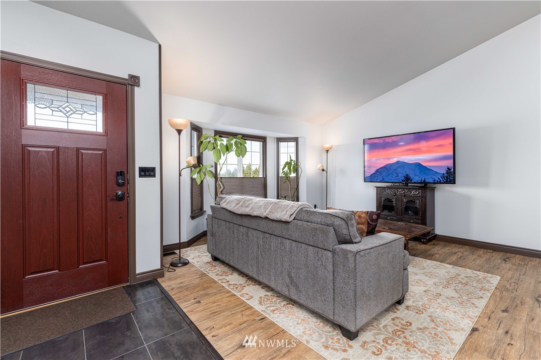 25904 202nd Avenue Southeast Covington, WA 98042 - Photo 3 of 24 a living room with furniture and a flat screen tv