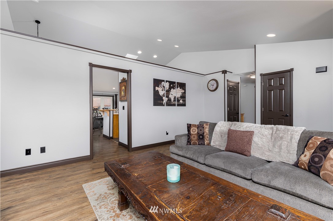 25904 202nd Avenue Southeast Covington, WA 98042 - Photo 5 of 24 a living room with furniture and wooden floor