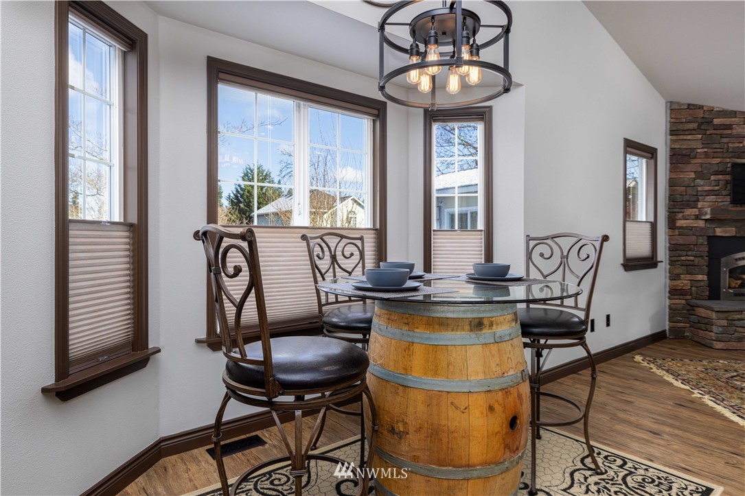 25904 202nd Avenue Southeast Covington, WA 98042 - Photo 6 of 24 a view of a dining room with furniture window and outside view