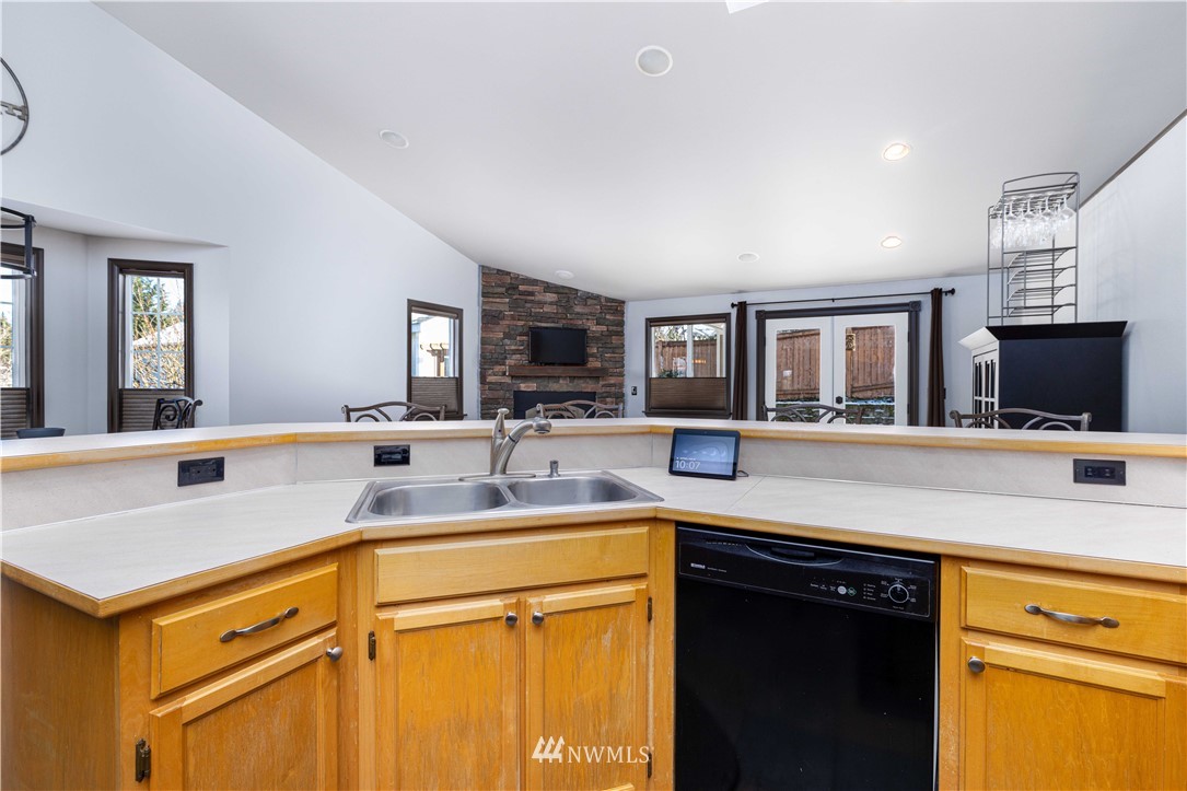 25904 202nd Avenue Southeast Covington, WA 98042 - Photo 8 of 24 a kitchen with a sink stove and cabinets