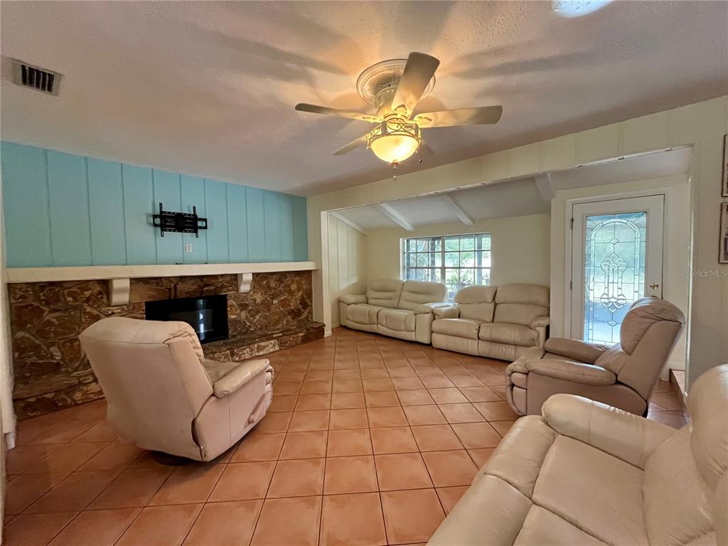 6604 Flicker Court Seffner, FL 33584 - Photo 11 of 32 a living room with furniture and a large window
