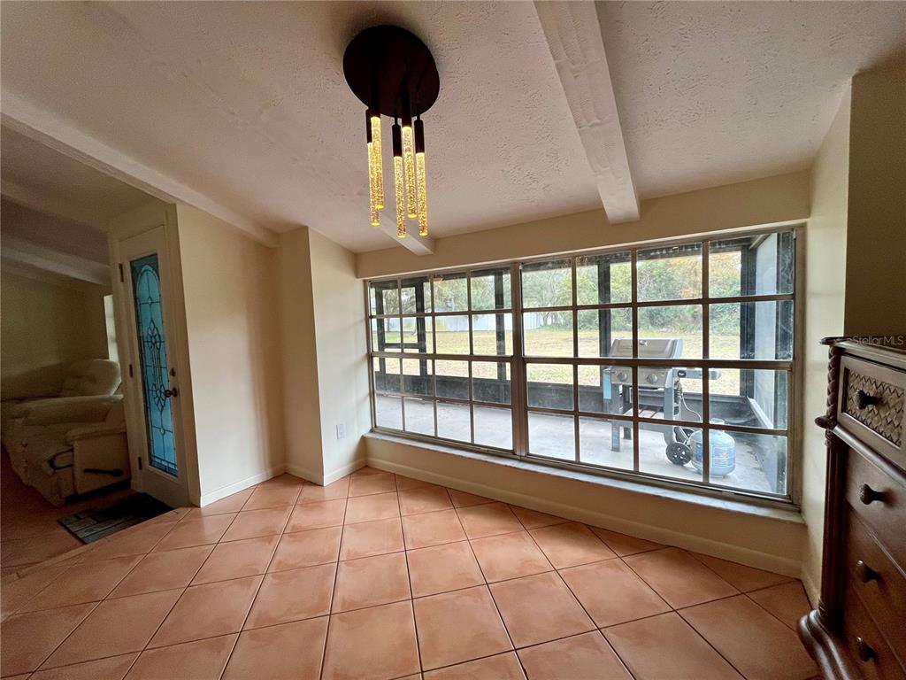 6604 Flicker Court Seffner, FL 33584 - Photo 17 of 32 a view of an empty room with a window