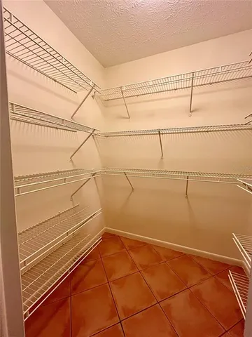a view of a room with racks on the wall
