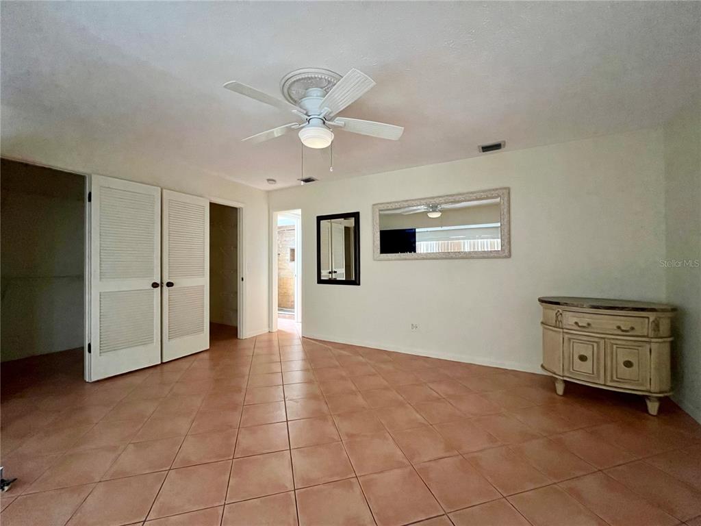 6604 Flicker Court Seffner, FL 33584 - Photo 26 of 32 a view of an empty room with a window