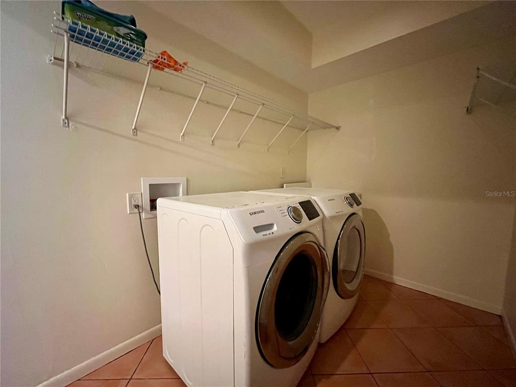 6604 Flicker Court Seffner, FL 33584 - Photo 27 of 32 a utility room with dryer and washer