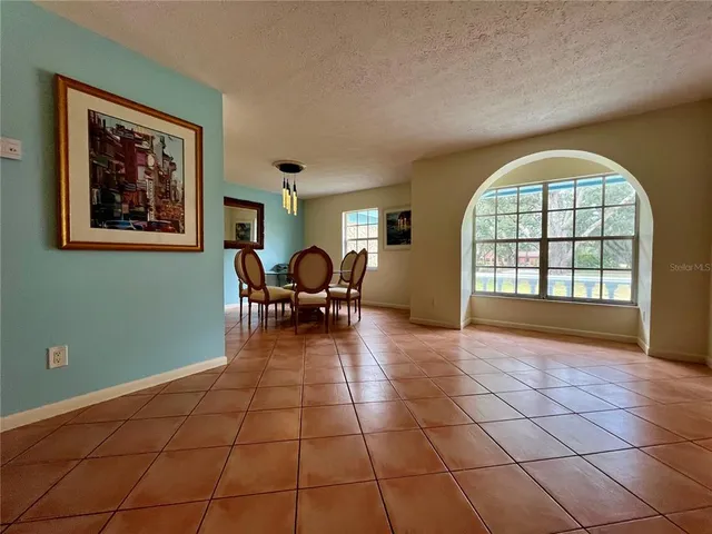 a view of a livingroom with furniture and window