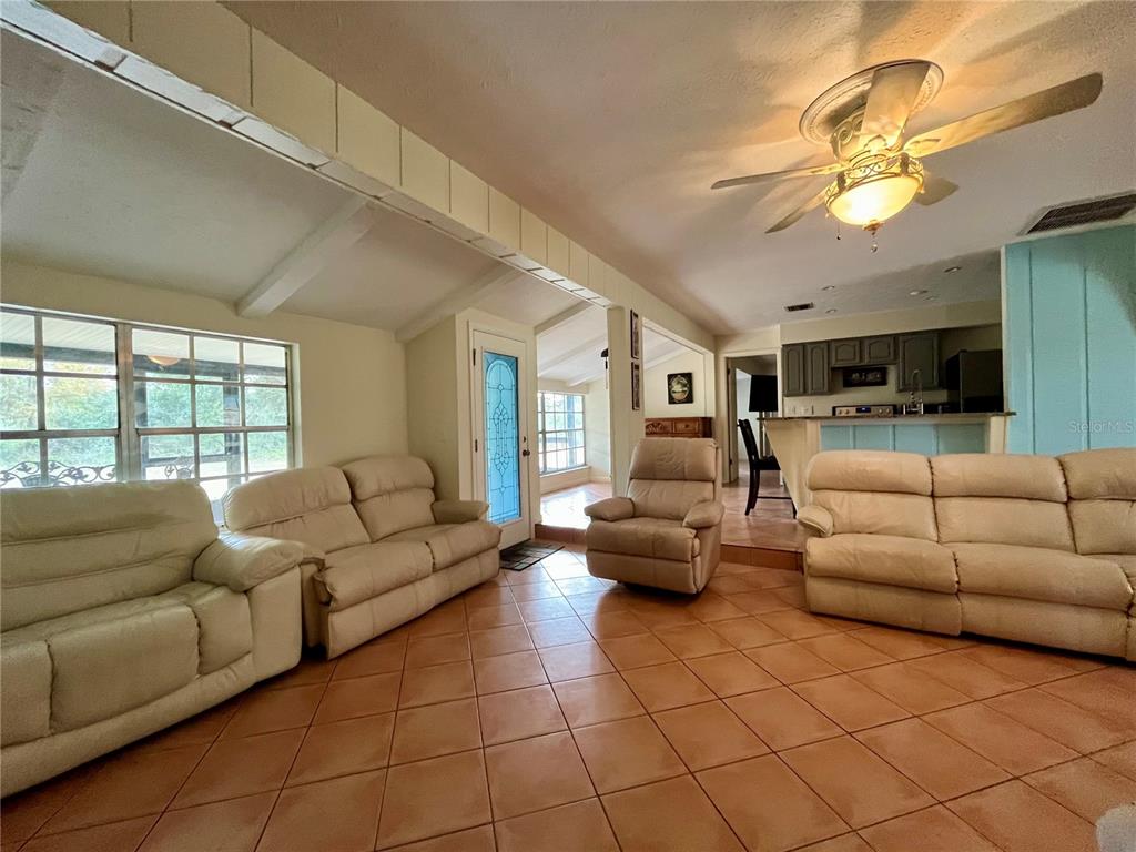 6604 Flicker Court Seffner, FL 33584 - Photo 10 of 32 a living room with furniture and a large window