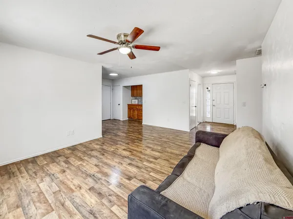 a living room with furniture and a window