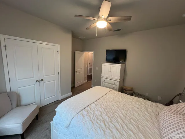 a bathroom with a sink vanity granite and toilet