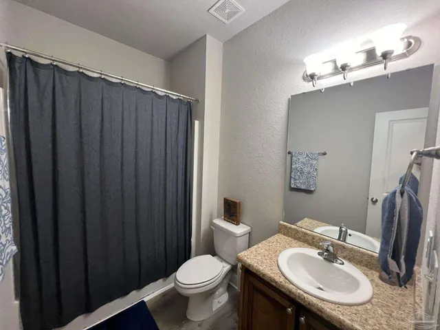 a room with gym equipment and view mirror