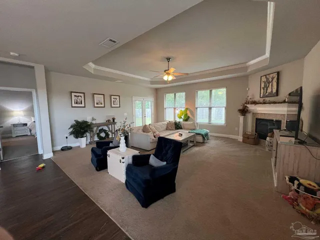 a living room with furniture window and wooden floor