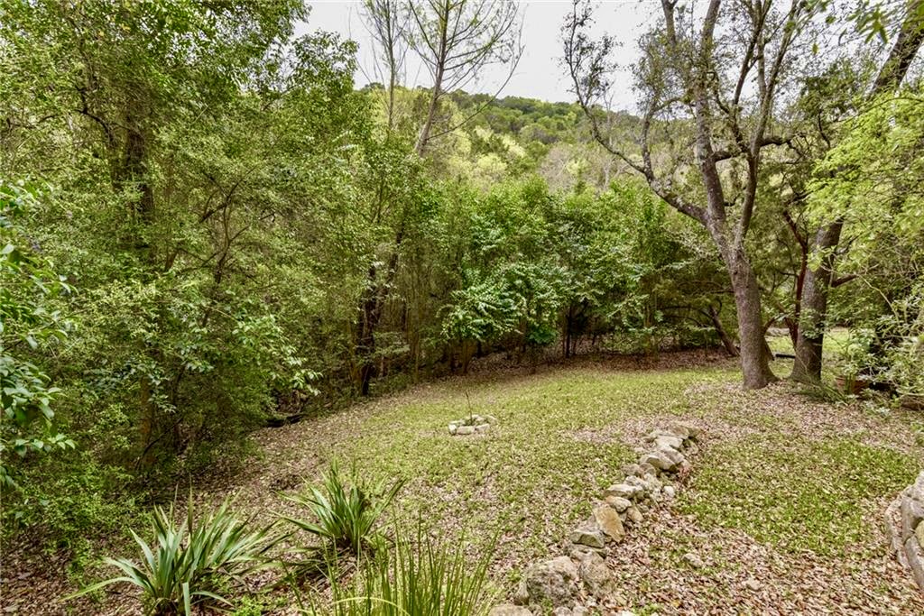 6815 Cougar Run Austin, TX 78731 - Photo 25 of 27 Back yard with lots of trees, perfect for pets