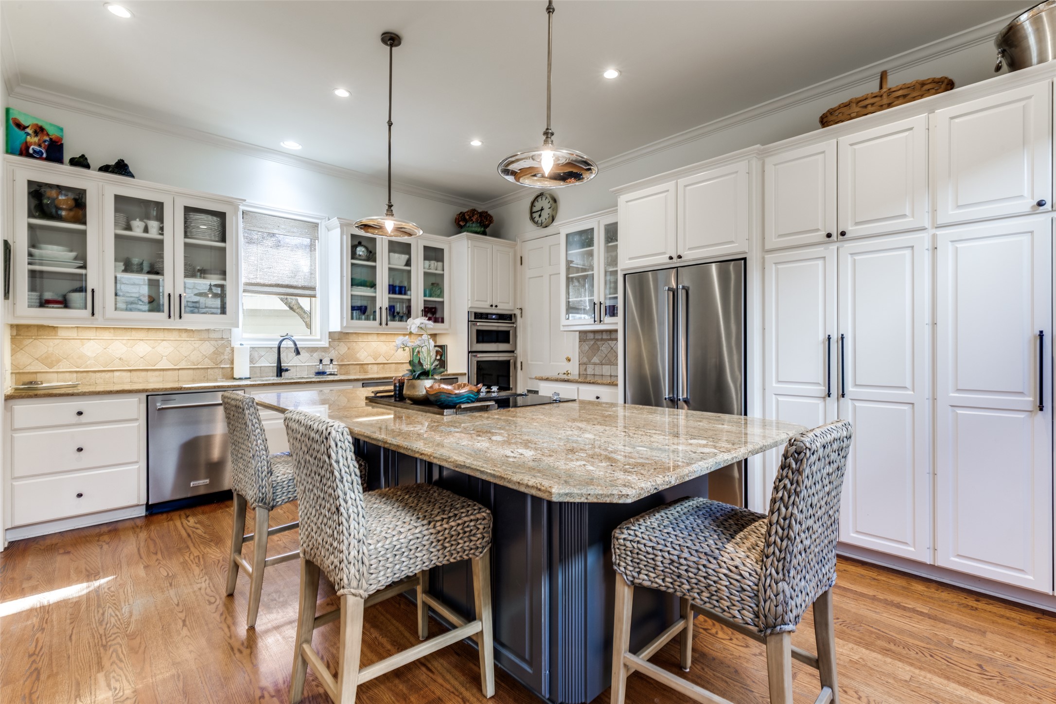 6815 Cougar Run Austin, TX 78731 - Photo 7 of 27 Open kithcen with all updated KitchenAide appliances including ice maker, wine fridge and warming drawer.