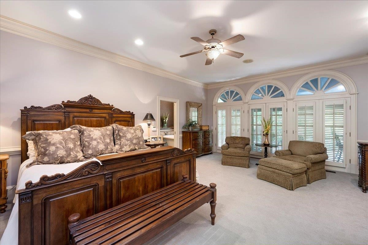 1213 Marlowe Road Raleigh, NC 27609 - Photo 13 of 30 Large First Floor Owner's Suite with doorway to deck, heavy crown molding, custom built-ins with storage. Owner'S Suite