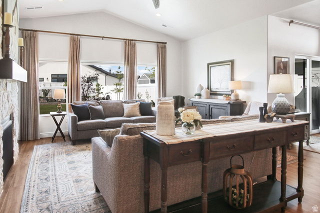 910 South 1700 West Layton, UT 84041 - Photo 11 of 26 Living room featuring wood finished floors and a stone fireplace
