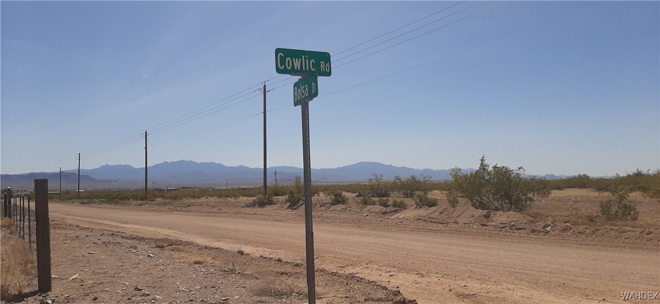 0 South Cowlic Road, Unit 85 Golden Valley, AZ 86413 - Photo 1 of 7 a view of a road with a pole