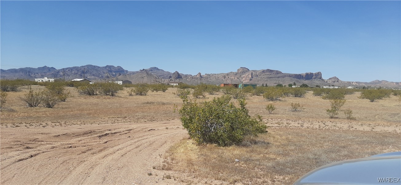 0 South Cowlic Road, Unit 85 Golden Valley, AZ 86413 - Photo 2 of 7 a view of lake with mountain