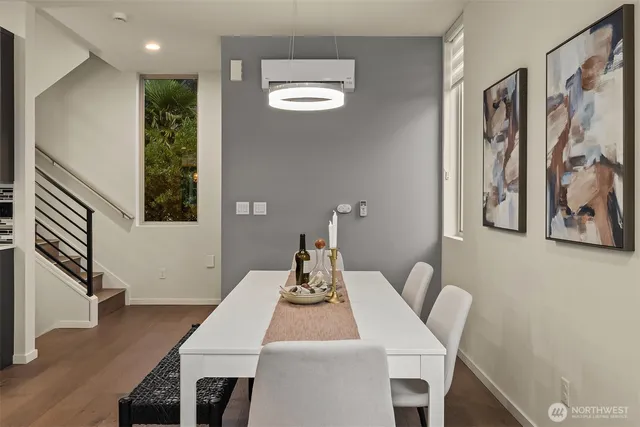 a dining room with a table and chairs