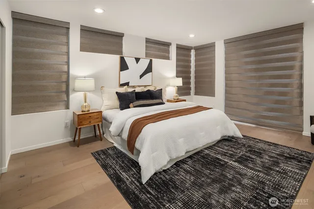 a bed room with a bed and a window