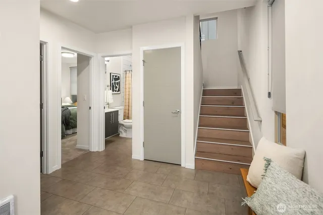 a view of a livingroom with furniture and stairs