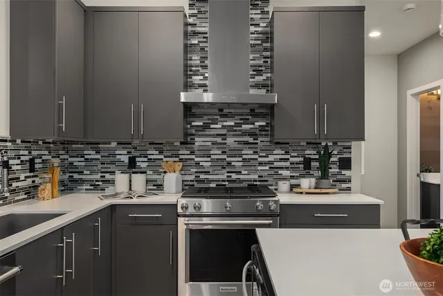 a kitchen with a sink a stove and cabinets