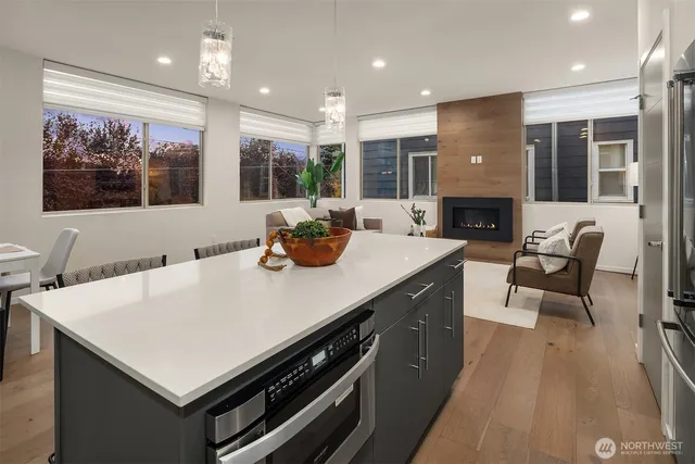 a kitchen with a stove a sink and a refrigerator