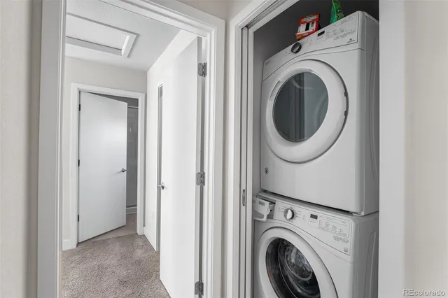 a view of a hallway with washer and dryer