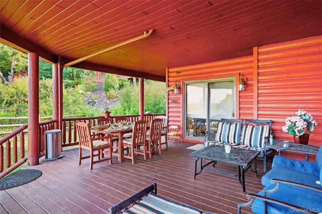 a view of a balcony with a floor to ceiling window
