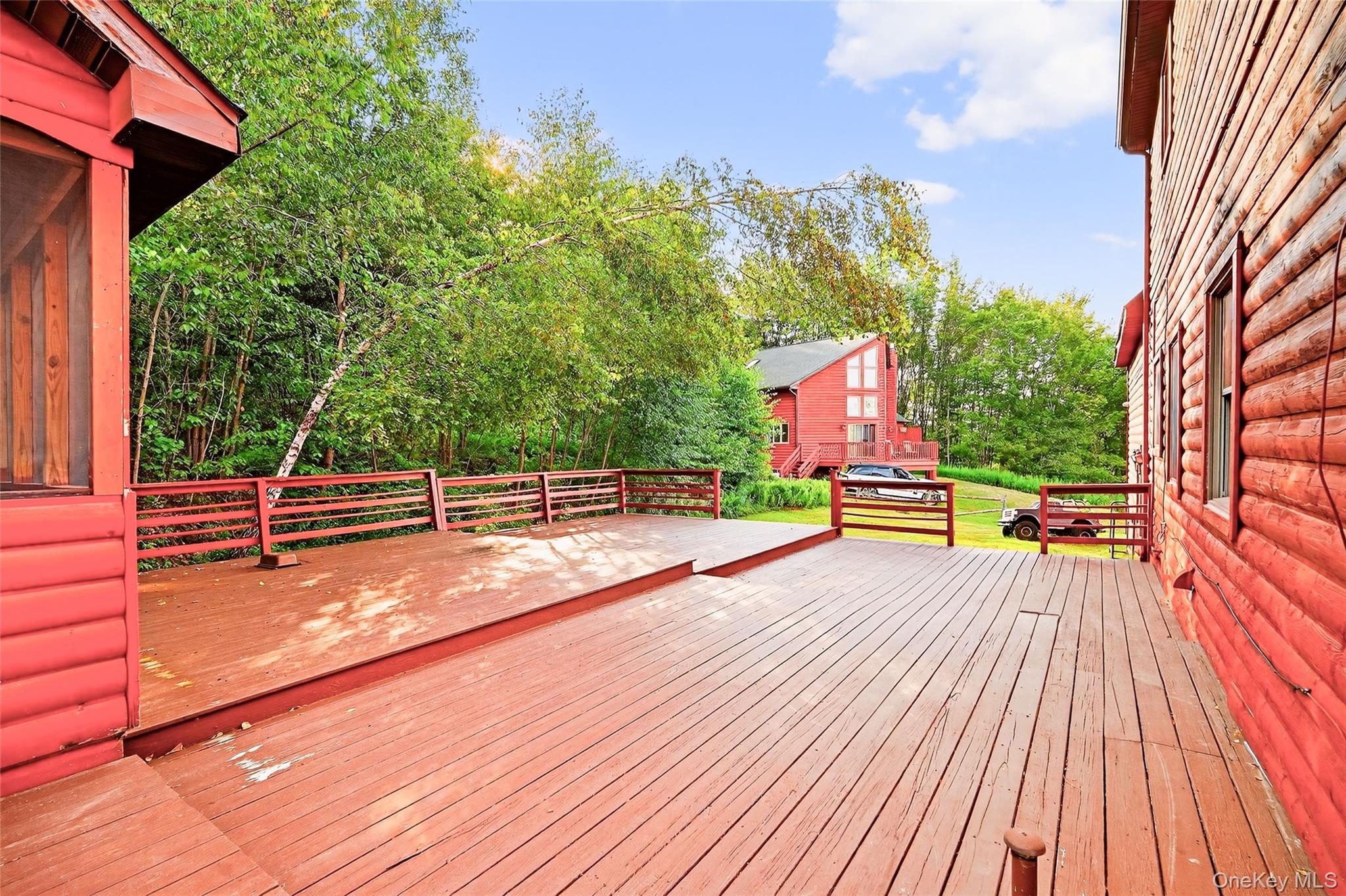 987 Hurd Road Jeffersonville, NY 12748 - Photo 16 of 50 a view of a swimming pool with a bench and wooden floor