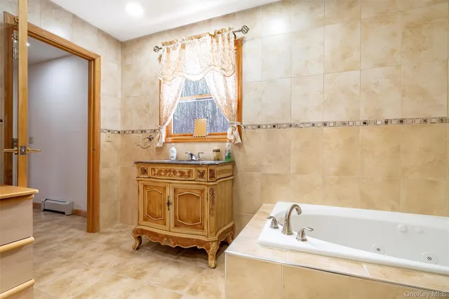 a view of a bedroom with wooden floor and cabinet