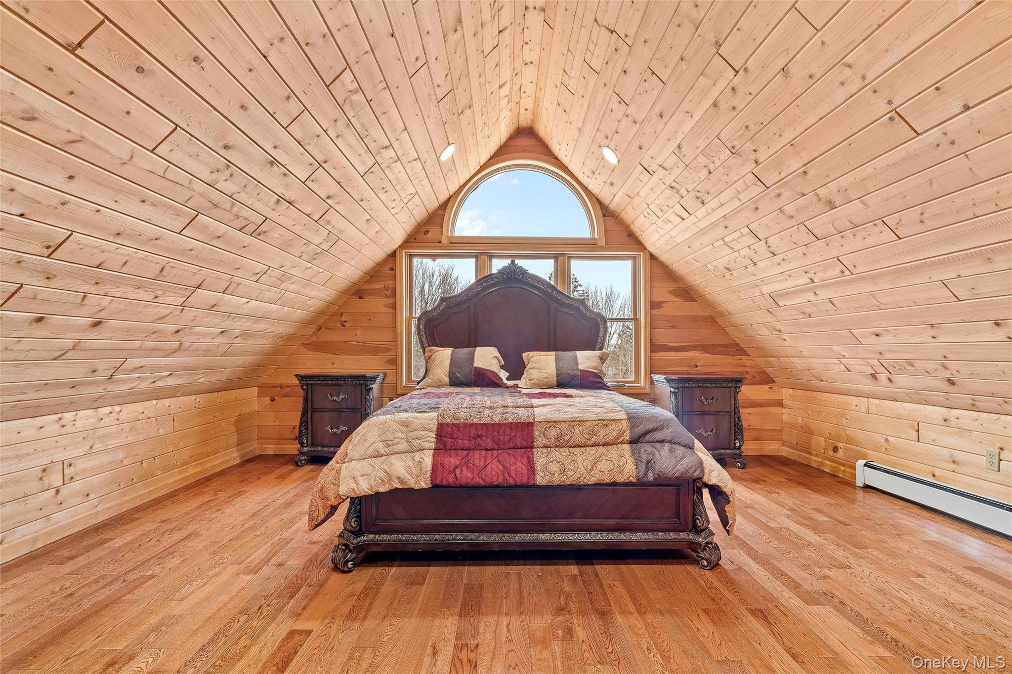 987 Hurd Road Jeffersonville, NY 12748 - Photo 50 of 50 a bedroom with a bed and a night stand