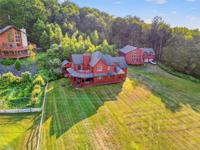 a front view of a house with a yard table and chairs