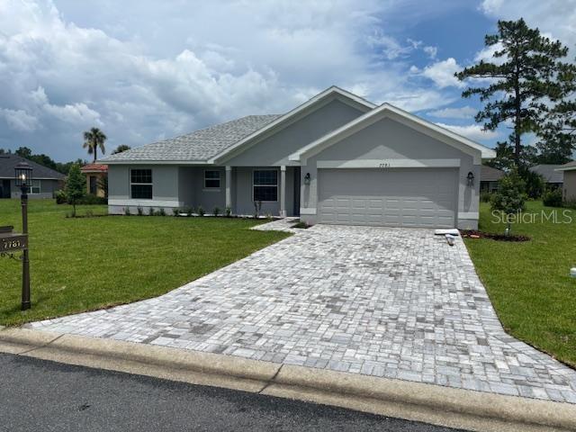 7781 Southwest 180th Circle Dunnellon, FL 34432 - Photo 2 of 20 front view of house with a yard