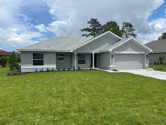 7781 Southwest 180th Circle Dunnellon, FL 34432 - Photo 3 of 20 a front view of house with yard and green space