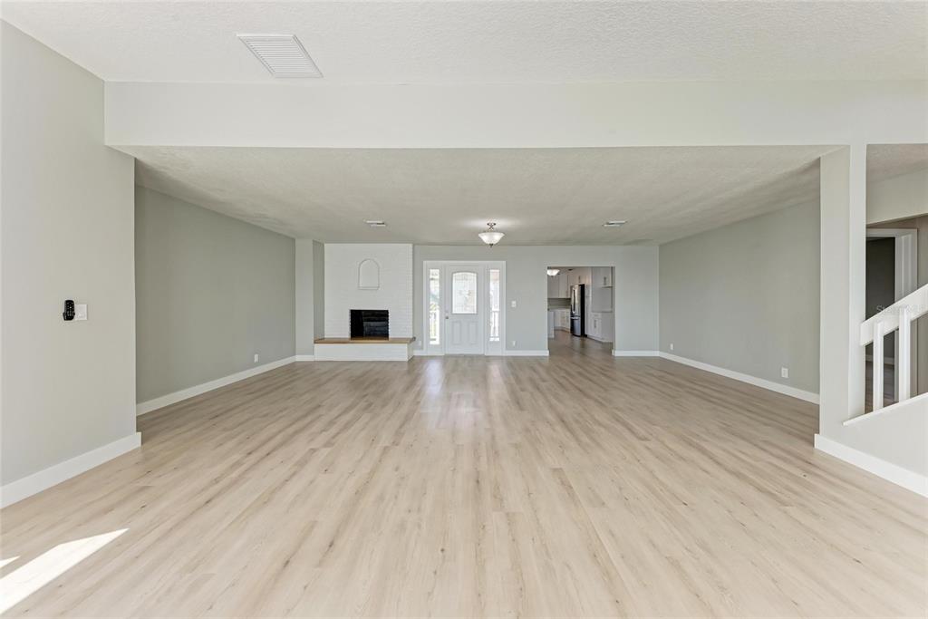 893 North Shore Drive Anna Maria, FL 34216 - Photo 14 of 62 a view of a big room with wooden floor and windows